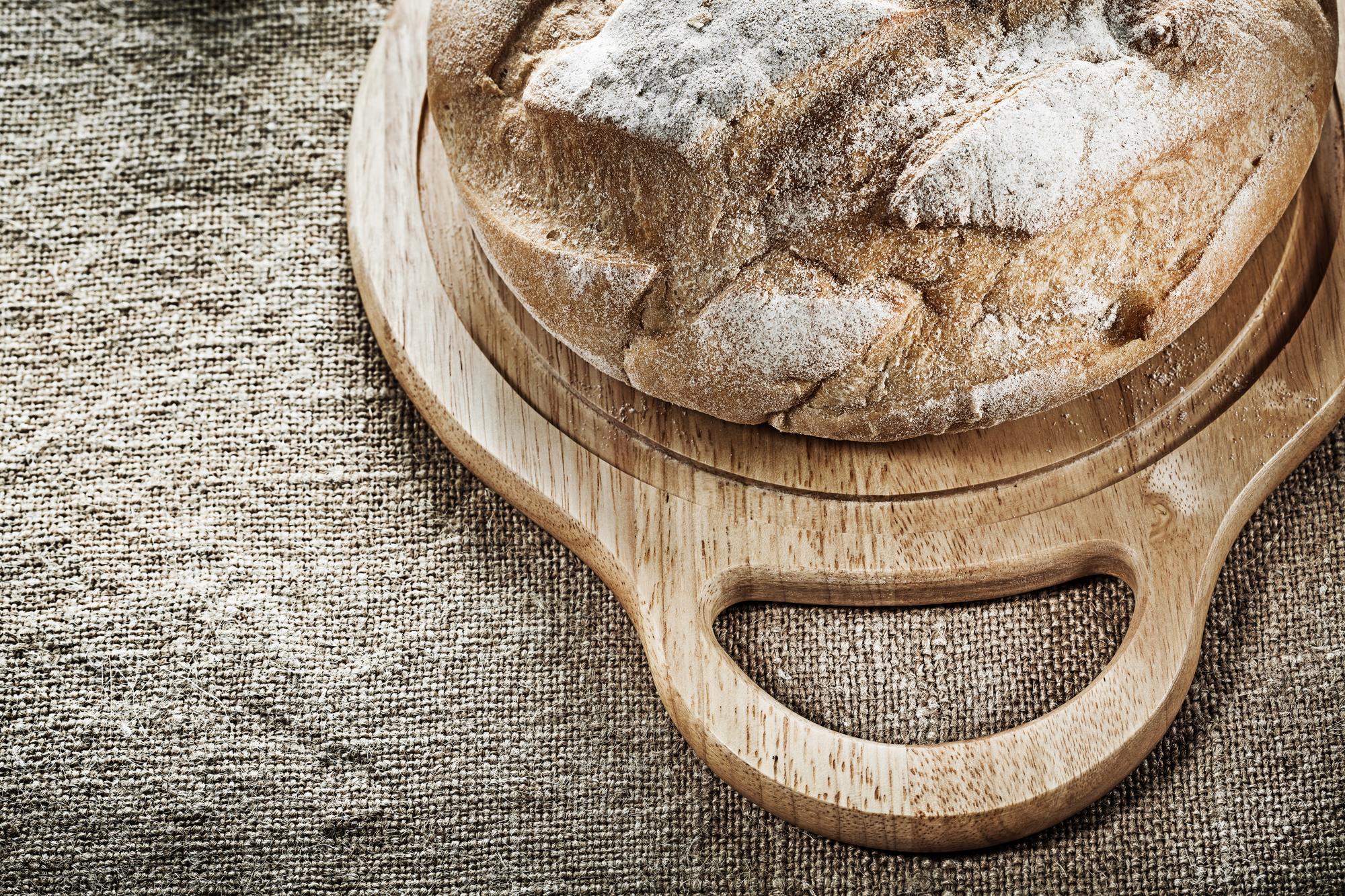 Freshly baked sourdough loaves on board